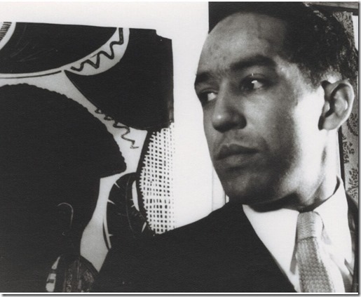 Langston Hughes in front of graphic